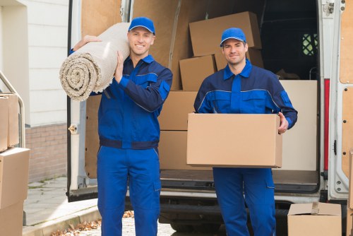 A local removal team loading items for a move in Morden