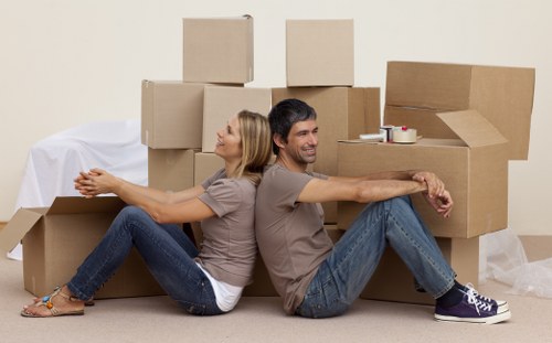 Professional removals team handling furniture and boxes in Morden