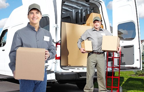 Organised household belongings and boxes prepared for a home relocation in Morden