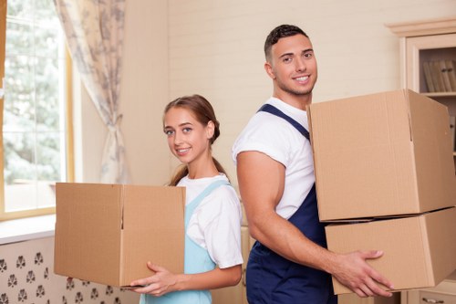 Local flat removals in Morden with a moving van outside apartments